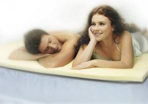 The Body Impressions Theratouch Night Therapy Mattress Topper in use
